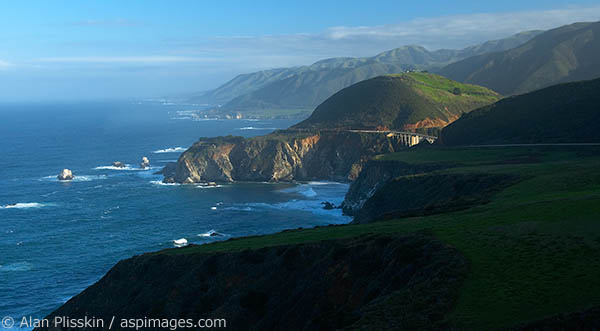 Dawn light breaks across the dramatic Big Sur section of the Central California coastline.