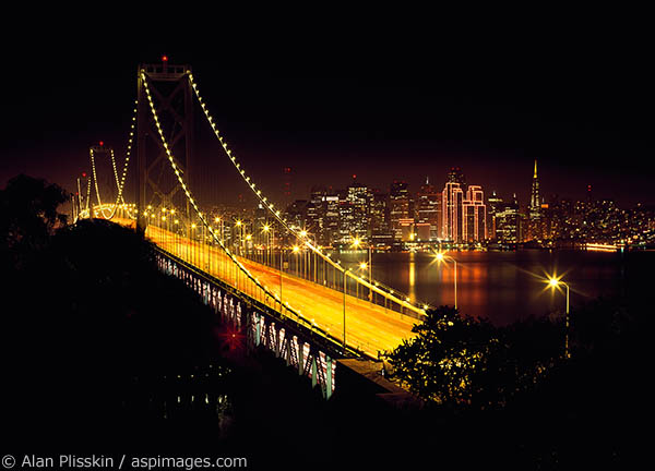 The Bay Bridge and San Francisco lit up during the holiday season.
