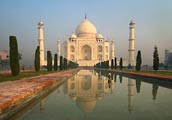 The Taj Mahal has a faint glow at dawn.
