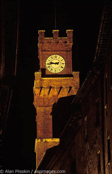 At night the clock tower in this Tuscan town takes on a different feel.