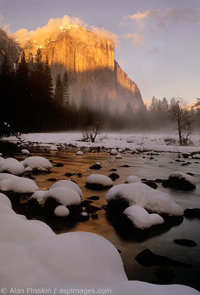 The sun broke through at the end of a cold winter day to light up the face of El Capitan in Yosemite National Park.