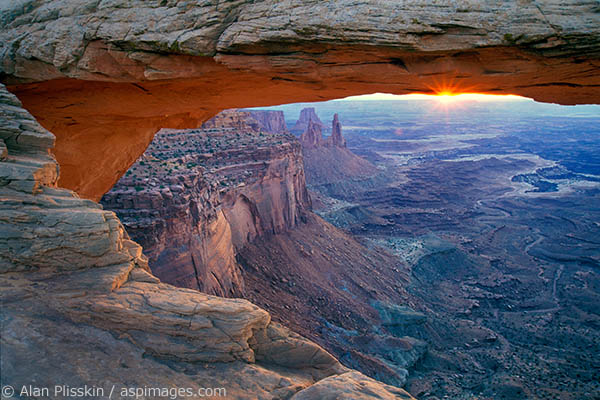 The sun shone for just a second at sunrise behind this famous arch in Canyonlands National Park.
